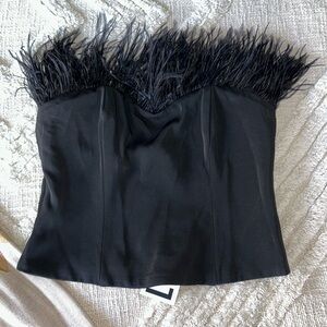 Black strapless top with feathers